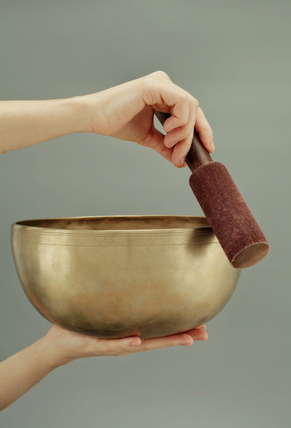 Individual sound therapy session using Tibetan singing bowls